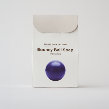 blue body soap in the shape of a ball in a box