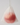 a pink ball of body soap in a mesh bag