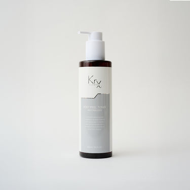black pump bottle of facial toner with white label