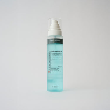 bottle of blue skincare liquid in a spray bottle
