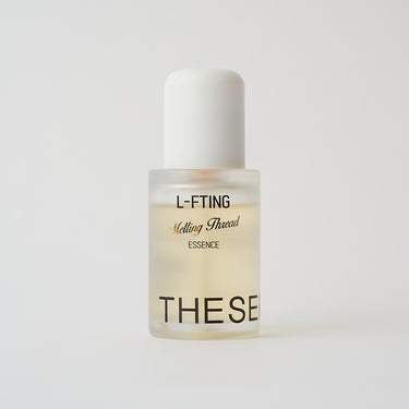 clear bottle of a yellow facial serum