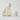 3 skincare products lined up next to each other in clear packaging and white caps