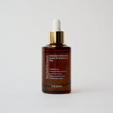 amber glass bottle with facial serum inside
