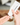 skincare cream being squeezed onto someone's hand 