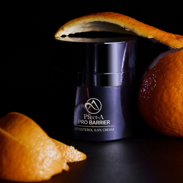 skincare product with orange peel on top of it 