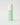 green bottle of skincare with a white top