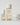 3 skincare products lined up next to each other in clear packaging and white caps