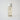 yellow liquid skincare in a clear bottle with a white top 