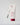 a white bottle of face mask with a face mask brush leaning up against it