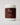 face mask in a cylinder container and brown label