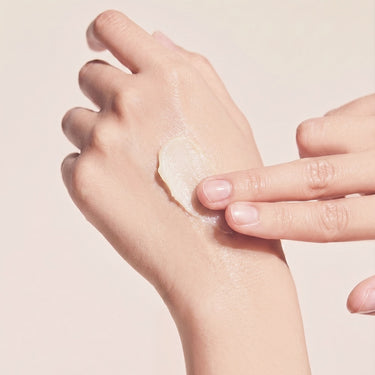 showing skincare texture on the back of someone's hand 